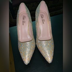 Selling these 4 inch heels in the color gold with iridescent gems